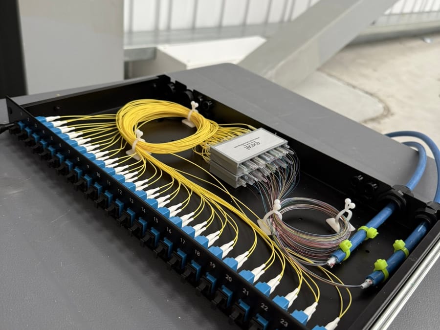 48-core OS2 LC fibre panel with spliced pigtails neatly coiled